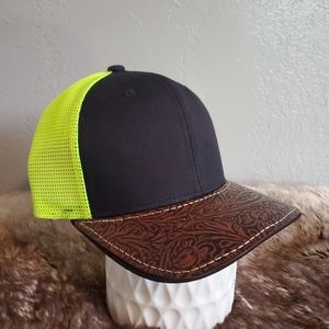 Ball cap with hand-sewn leather patch on brim